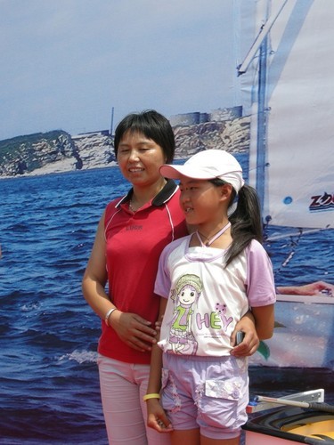 Winner of the new Optimist and her mother at Rizhaou © Lynn Fitzpatrick